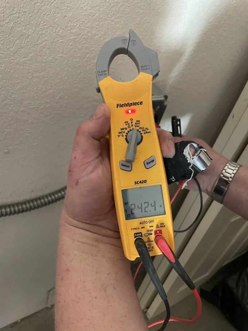 Voltage testing with clamp meter during Ceiling Fan Installation in Indian River Estates